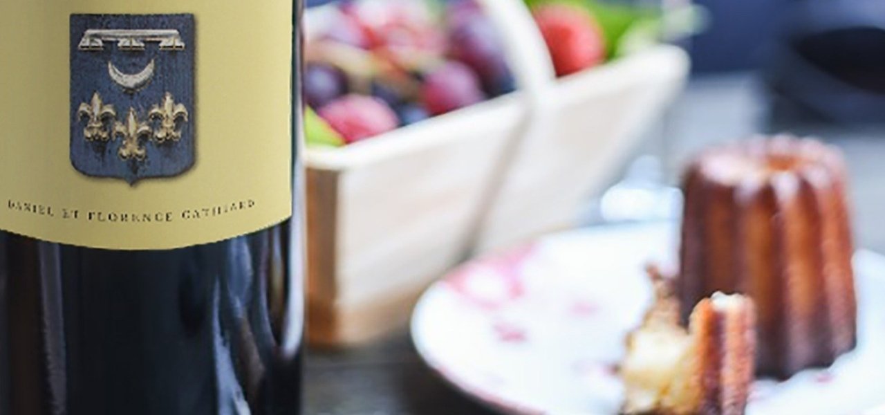 Château Smith Haut Lafitte wine bottle and Canelé - Wine Paths